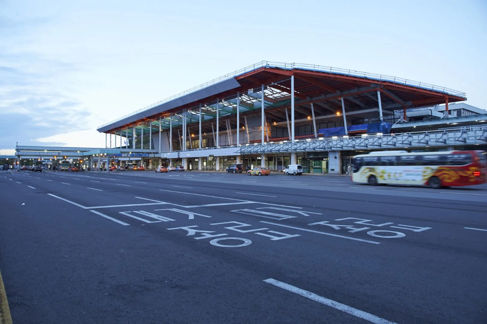 Gimpo International Airport (GMP) — WIZMO black sedan and chauffeur at terminal