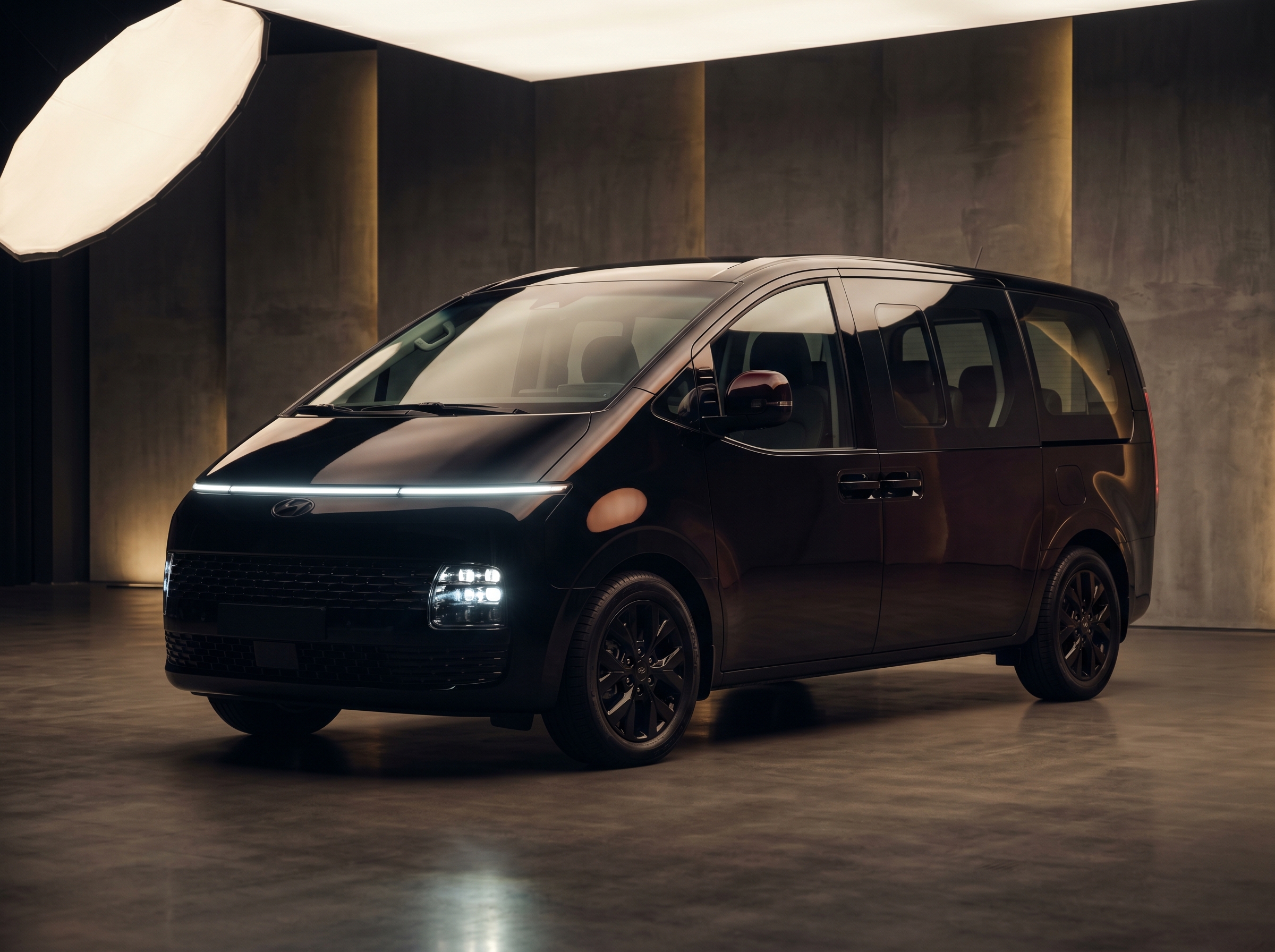 Hyundai Staria — black exterior studio shot